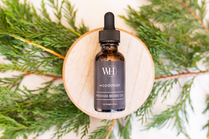 Willow Hill Soap Company Woodsman premium beard oil surrounded by pine 